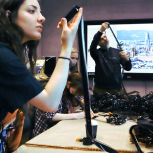 Students examining old film cells. Photographed by Sander Põldsaar and edited by Lyza Jarvis