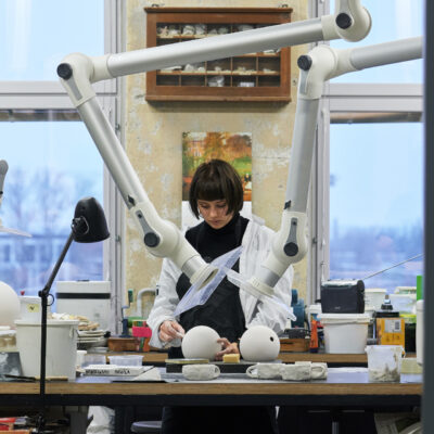 Student Mariann Hendrikson casting and sanding a lamp form. AEGLUS – Collaboration project with Estoplast. Supervisors Maria Pukk, Heikki Zoova, Karin Kalman. Photo: Valdek Laur. 2022